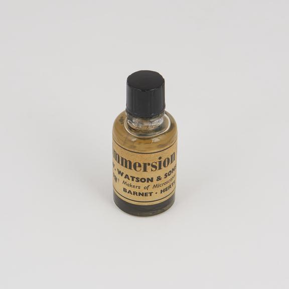 Bottle full of immersion oil supplied by W. Watson and Sons Ltd