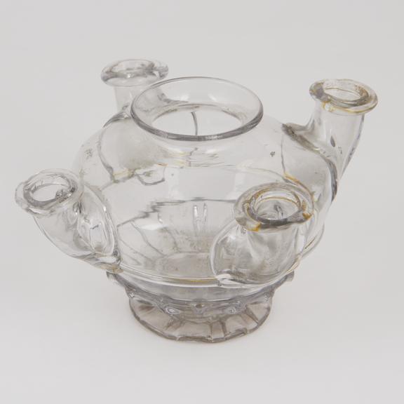 Early glass lamp with globular body short flared neck with four