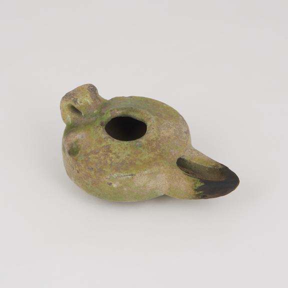 Roman style oil lamp, green glazed, approx 65 mm diameter