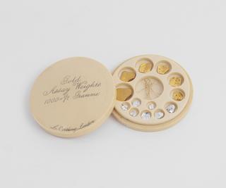 Gold assay weights in circular fitted case