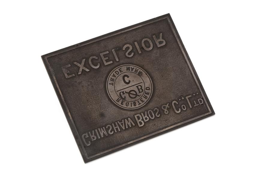 Grimshaw company logo cast onto metal plate