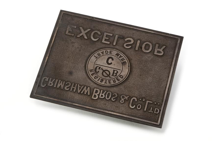 Grimshaw company logo cast onto metal plate