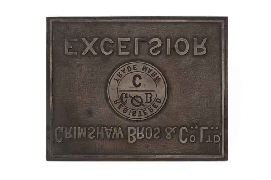 Grimshaw company logo cast onto metal plate