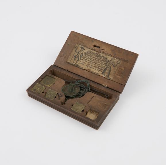 Pan scales in wooden box with weights