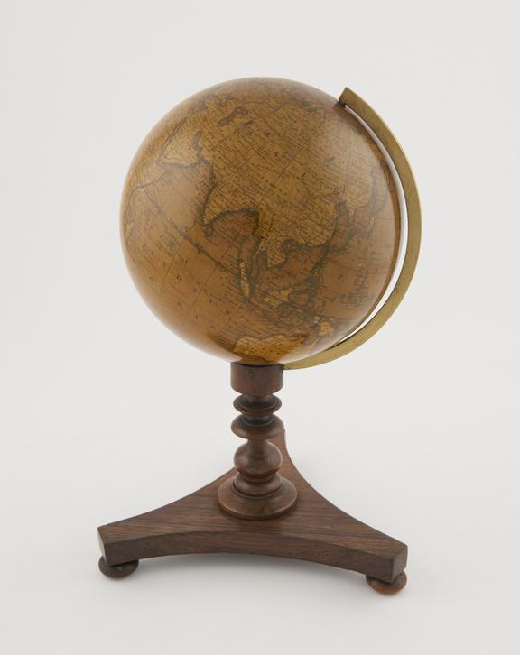 Terrestial globe of 5 1/2-inch dimeter on wooden pillar stand