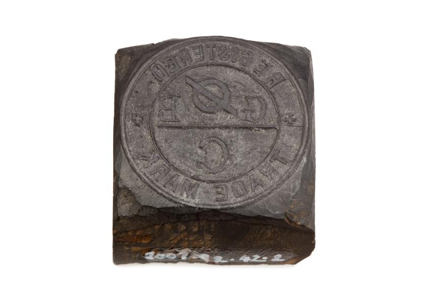 Wooden stamp with relief carving of Grimshaw Brothers