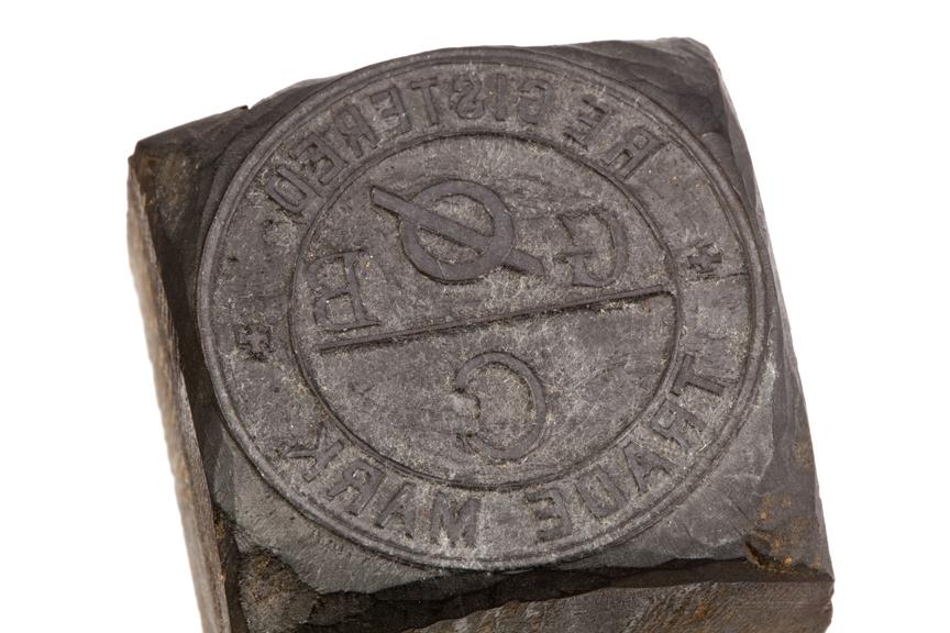 Wooden stamp with relief carving of Grimshaw Brothers