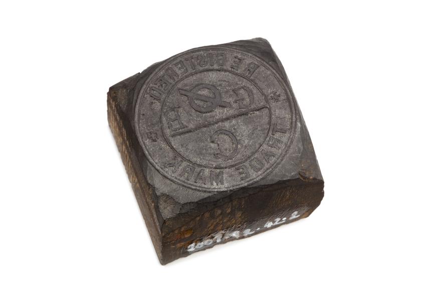 Wooden stamp with relief carving of Grimshaw Brothers