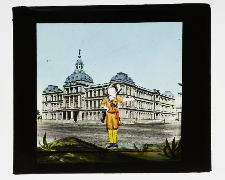 Magic lantern pose slide showing a man standing in front of a grand building with a rifle across his back