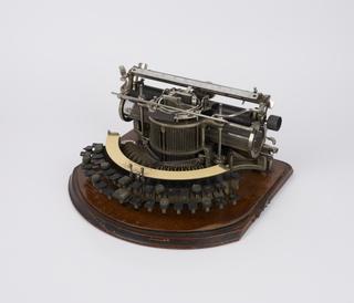 Hammond typewriter with 2-row curved keyboard and braille strip, c. 1894