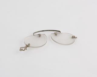 Rimless English clip eyeglasses with tear-shaped concave lenses