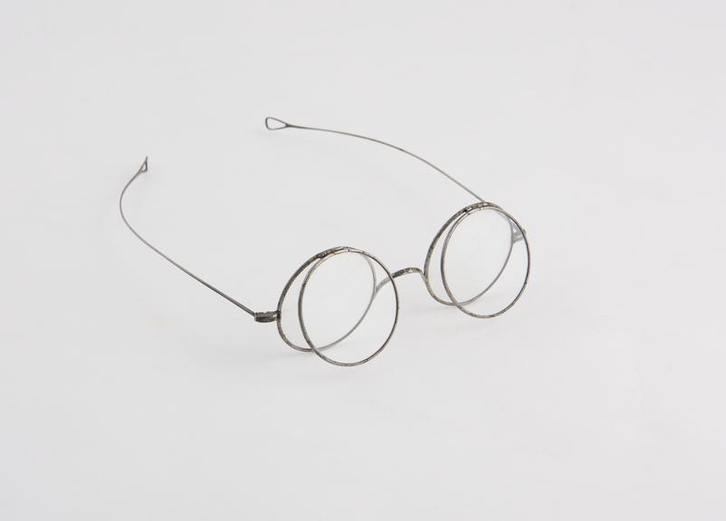 Spectacles with two sets of round lenses