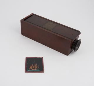 'New Optical Amusements' optical toy consisting of wooden box