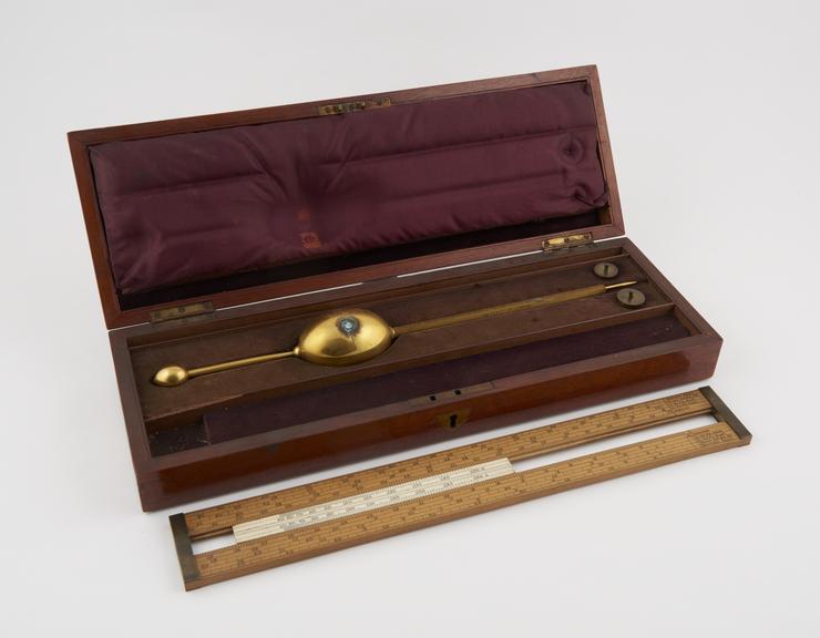 Gilt saccharometer by L Lumley & Co, London. In mahogany box