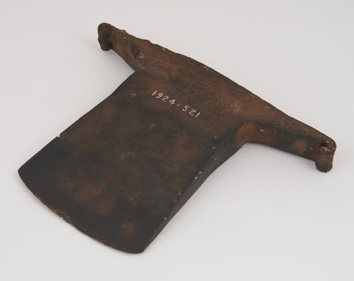 One plaster replica of an iron axe with side lugs of Egyptian