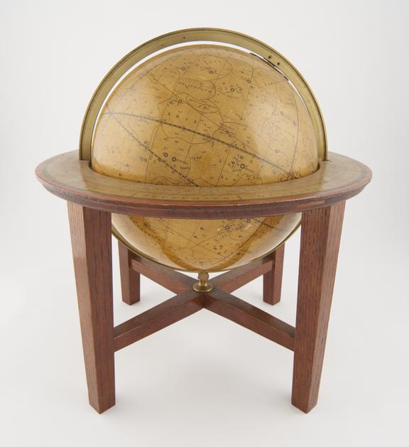 Celestial globe of  on later plain oak stand by J. & W