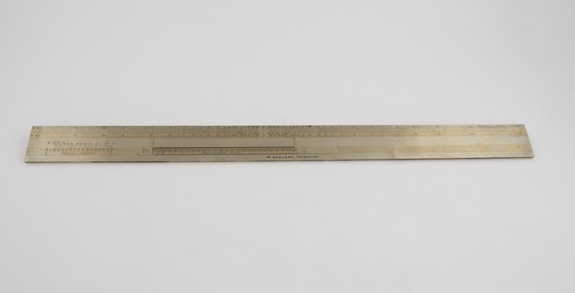 Slide rule for photographic applications by W. Ackland