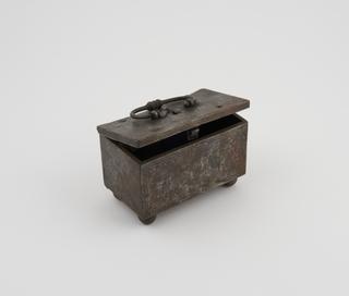 Small steel coffer with elaborate lock mechanism in lid