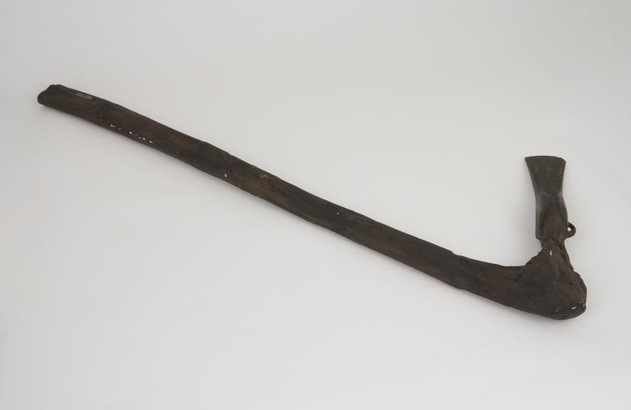 Reproduction of a bronze axe with wooden haft