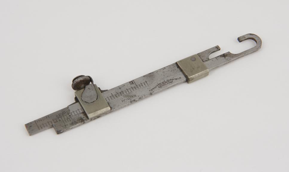 Ship's plate thickness measuring gauge with vernier scale.