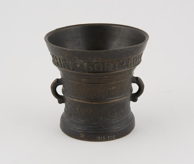 Bronze mortar, with two handles, decorated with an inscription