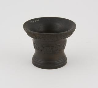 Bronze mortar with lettering and floral decoration