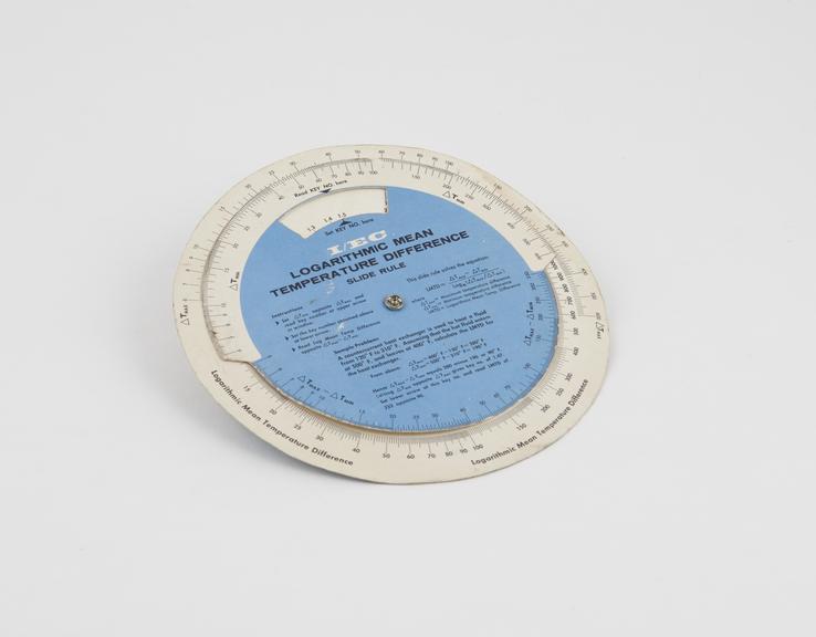 Circular slide rule, cardboard (warped)