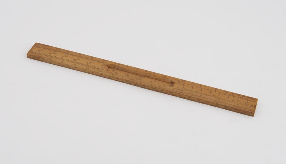 Linear slide rule with scale marked fiction', in boxwood'