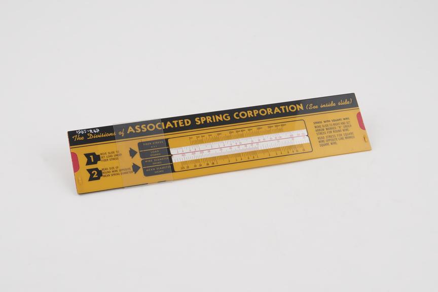 Slide rule for wire spring calculations with one slider