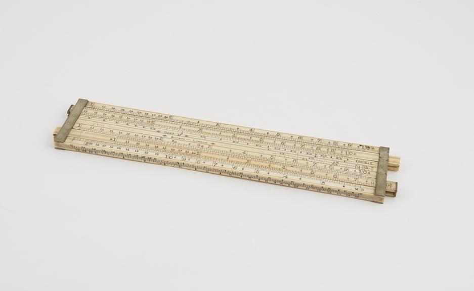 Excise slide rule, ivory, with two double-sided sliders