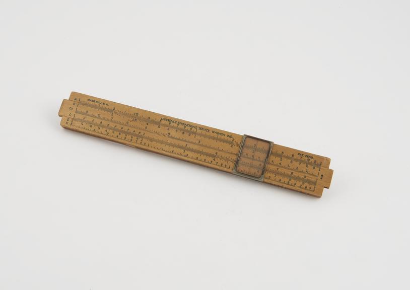 Wooden slide rule with plastic cursor and printed scales by