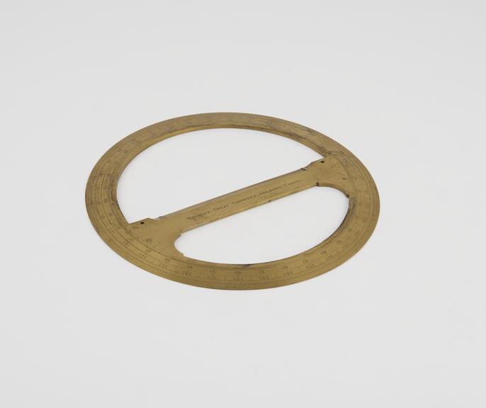 One of two brass 6-inch circular protractor