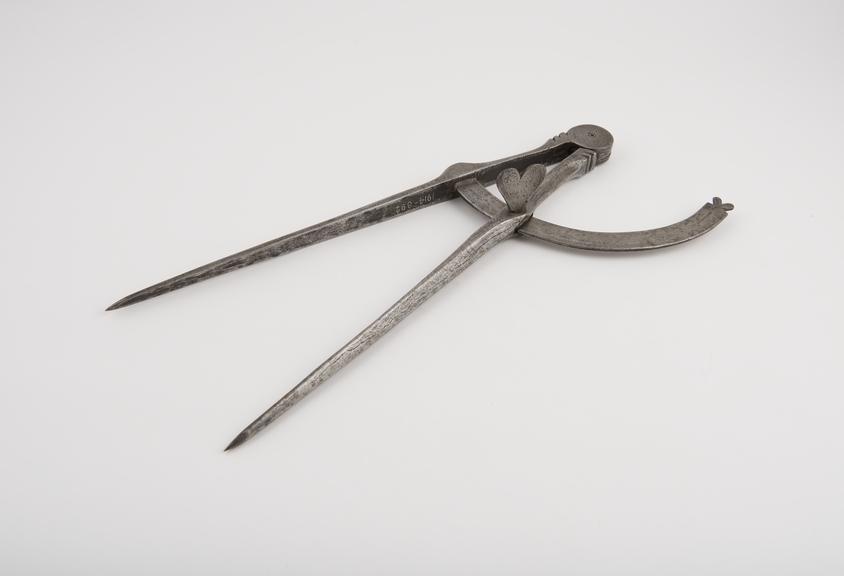 Pair of early iron dividers, by W and C Wynn