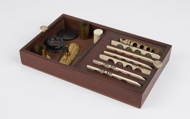 Drawer containing microscope accessories