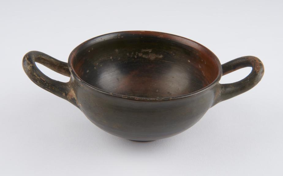 One of  five Southern Italian black and brown earthenware