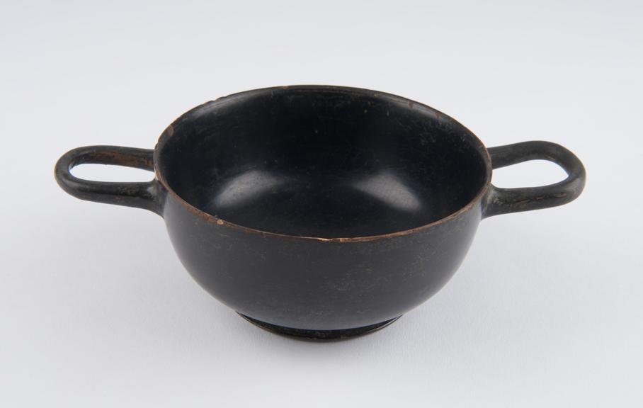 One of  five Southern Italian black and brown earthenware