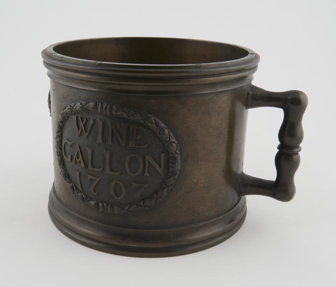 Queen Anne's Bronze standard wine gallon, 1707 (8 x 6 1/4')'