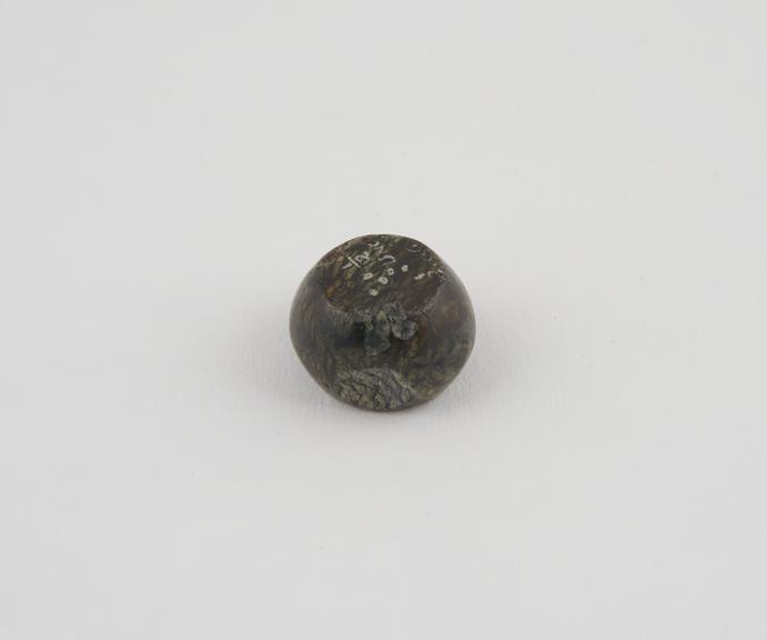 One of 15 Roman weights, cheese-shaped, polished black basalt