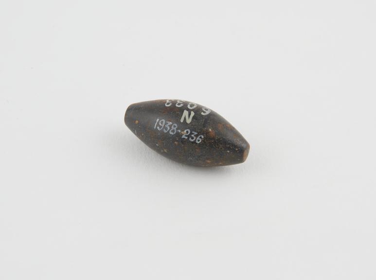 One of 5 haematite Syrian weights, barrel shaped, from Gaza