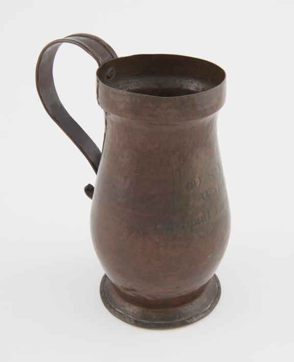 One of two copper measures with handles