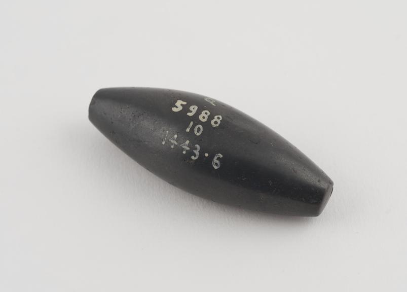 One of 9 black haematite Syrian weights, barrel shaped