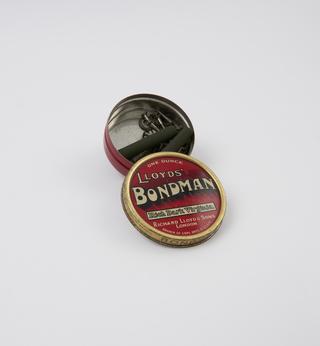 “Lloyds’ Bondman” tin containing metal and rubber components from the "Elswick" lady's bicycle