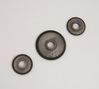 Part of a group of four toothed-wheel cutters