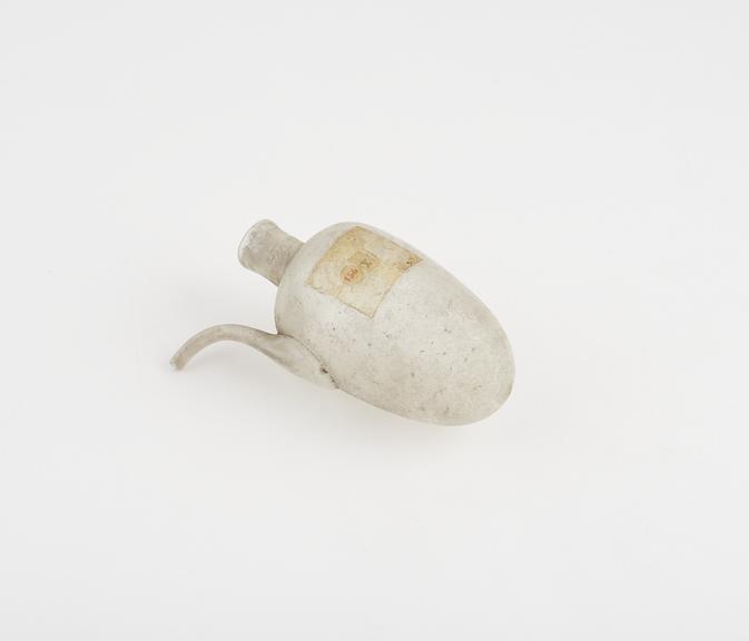 Small pear-shaped glass flask with narrow neck and side spout