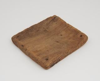 Square board with a hole drilled through each corner