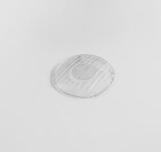 Section of glass taken from the centre of the Lucas type 700 headlamp