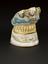 Lower denture of hippopotamus ivory, on ceramic stand