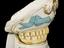 Lower denture of hippopotamus ivory, on ceramic stand