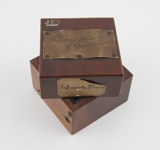 Wooden case for quartz Avoirdupois Pound known as "Q"
