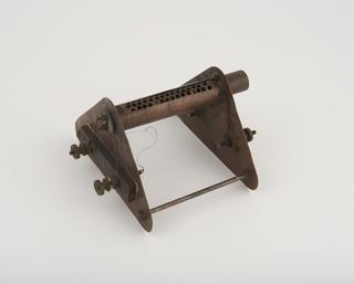 A frame stand for Smith's 120 mph chronometric speedometer